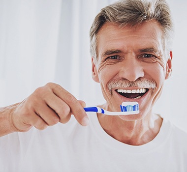 Man holding a toothbrush