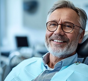 smiling older man in the dentist’s chair