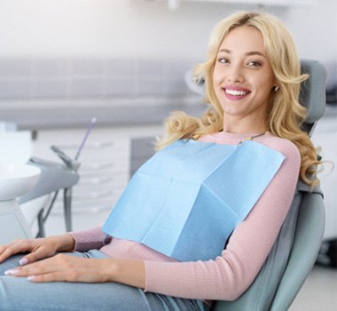 Smiling patient in dental treatment chair